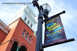 Sounds on Centre free Fernandina concert series in historic district downtown. Image -- Centre Street court house and concert banner.
