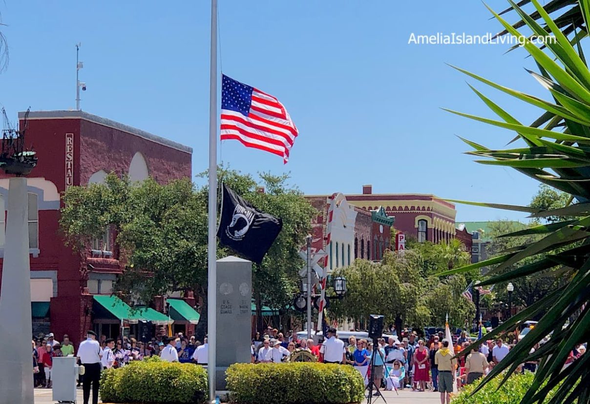 Memorial Day Ceremony, downtown Fernandina Beach. Flag half-staff at monument, foot of Centre Street. Photo by AmeliaIslandLiving.com