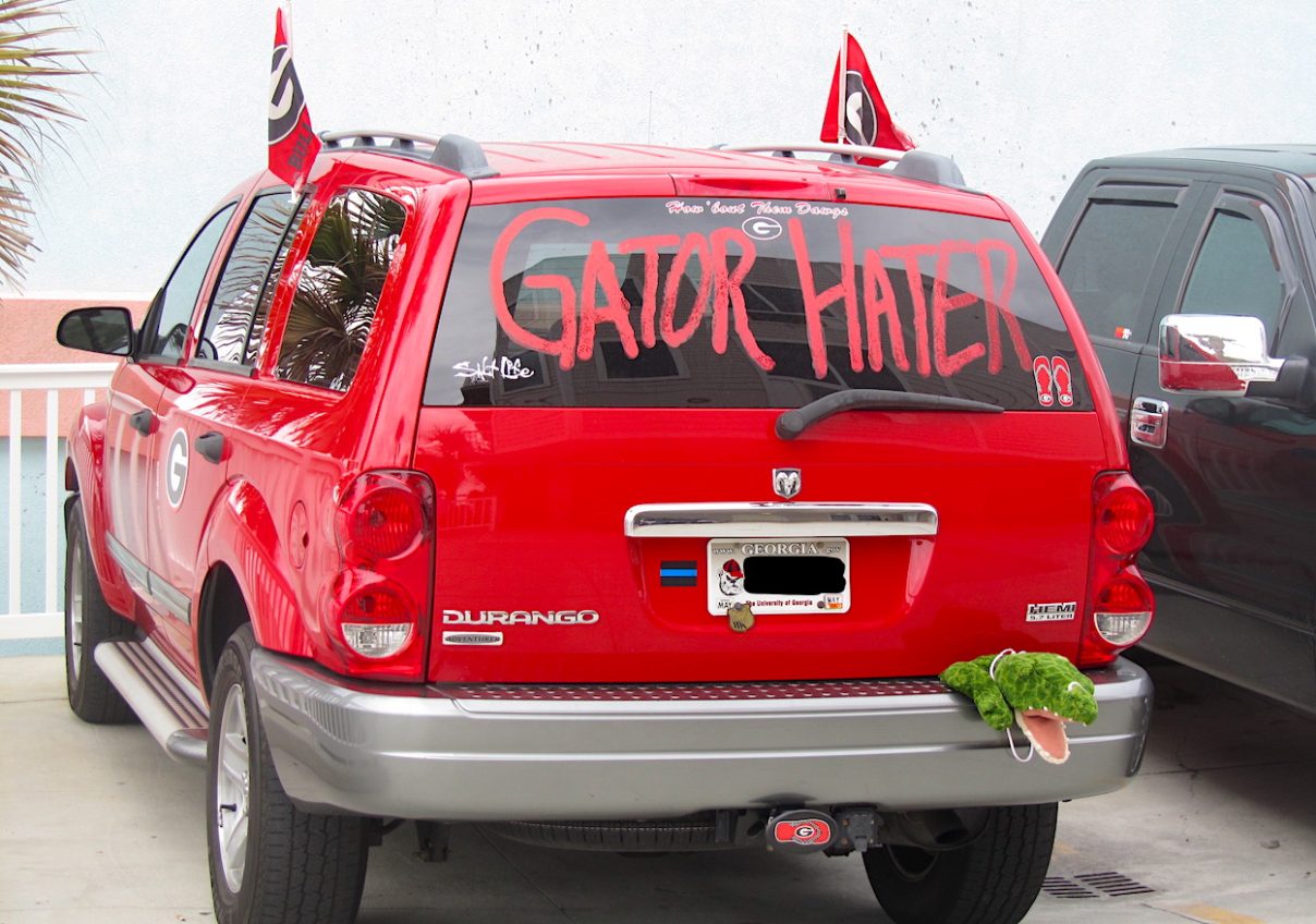 FANDOM ON DISPLAY -- Red "Gator Hater" decorated vehicle, parked by Fernandina's Main Beach Park. Florida-Georgia game. (Photo by AmeliaIslandLiving.com)